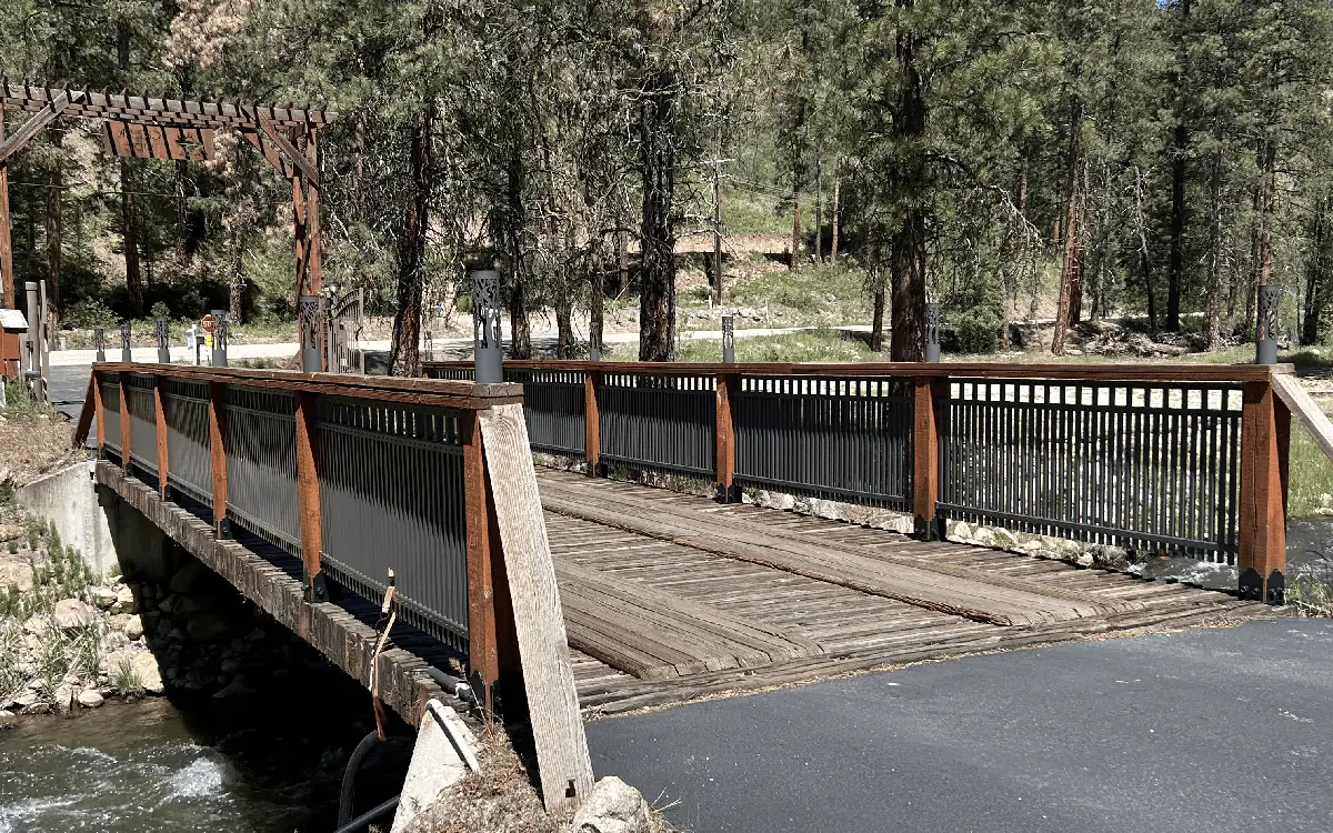 The private timber bridge over Mores Creek at the entrance to the property.